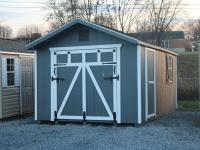 Pine Creek 10x16 HD Peak Front with Dark Gray walls, White trim and Black Z-Style shutters, and Charcoal shingles