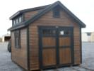 Pine Creek 10x12 Cape Cod with Coffee Polyurethane walls, Black trim and Black Z-Style shutters, and Charcoal shingles